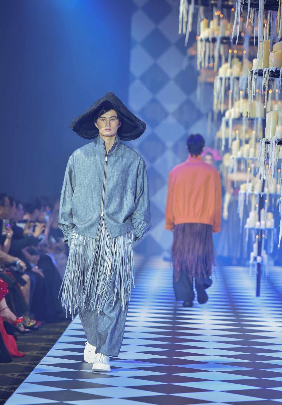 Easy bomber in linen/wool blend in gray matching pleated volume trousers and silk fringe detail.