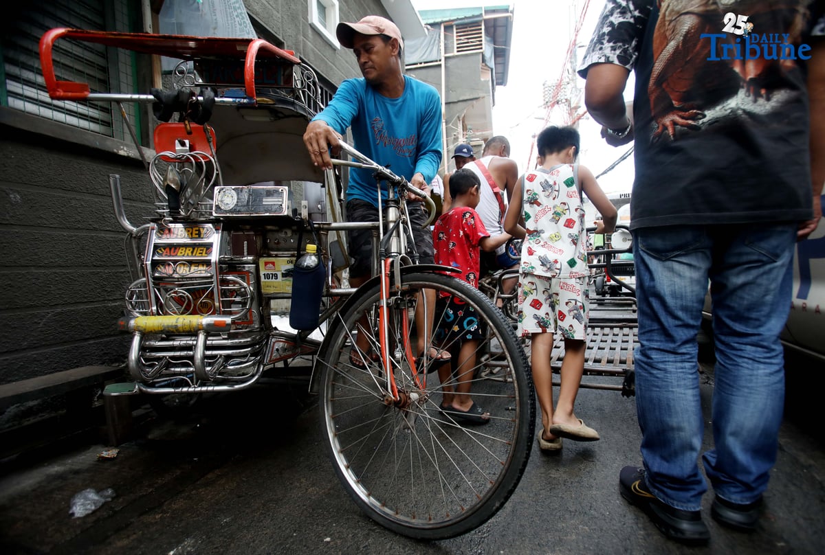 (October 09 2025) On Wednesday October 9 2025, a pedicab driver was seen driving a different from a normal pedicab. They used bigger wheels than normal to avoid flood, Navotas is often flooded specially during high tide. Photo/Analy Labor