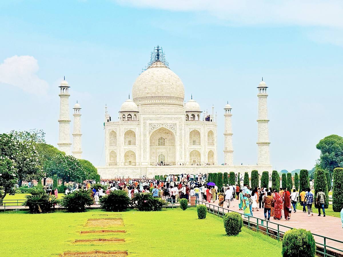 The first view is a shock to the nervous system: Taj Mahal emerging through the arch, and suddenly your chest feels too small to hold the scale of the precise marble. It’s love’s ultimate arrogance: perfect, impossible, entirely justified.