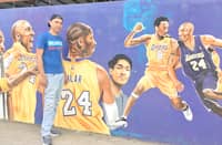 Batain with his mural in Malvar.