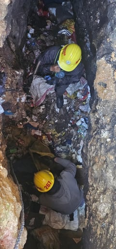 Sacks of garbage pulled from Benguet sinkhole blamed for La Trinidad floods