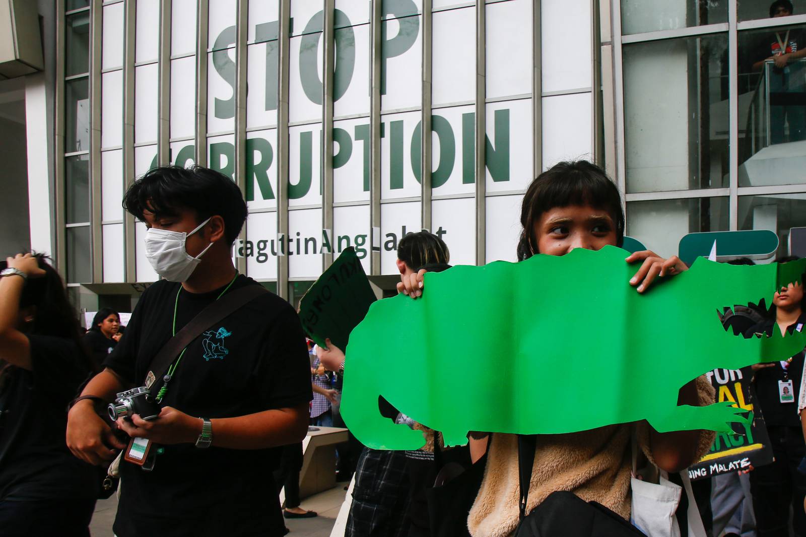 Students from the College of Saint Benilde (CSB) gather at the School for Design and Arts Campus (D+A Campus) along P. Ocampo Street on the afternoon of 13 October 2025 to protest against the worsening government corruption.