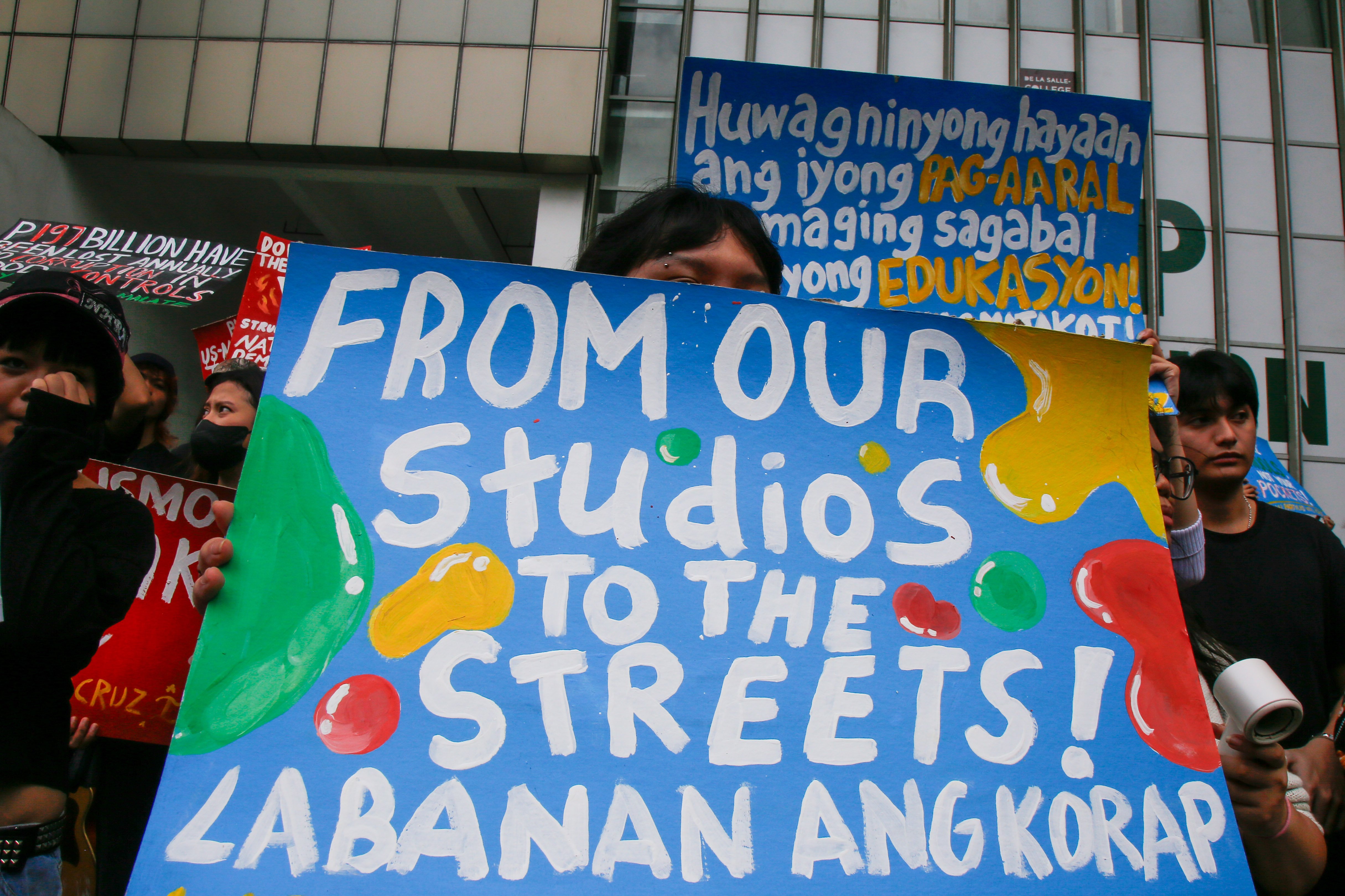 Students from the College of Saint Benilde (CSB) gather at the School for Design and Arts Campus (D+A Campus) along P. Ocampo Street on the afternoon of 13 October 2025 to protest against the worsening government corruption.