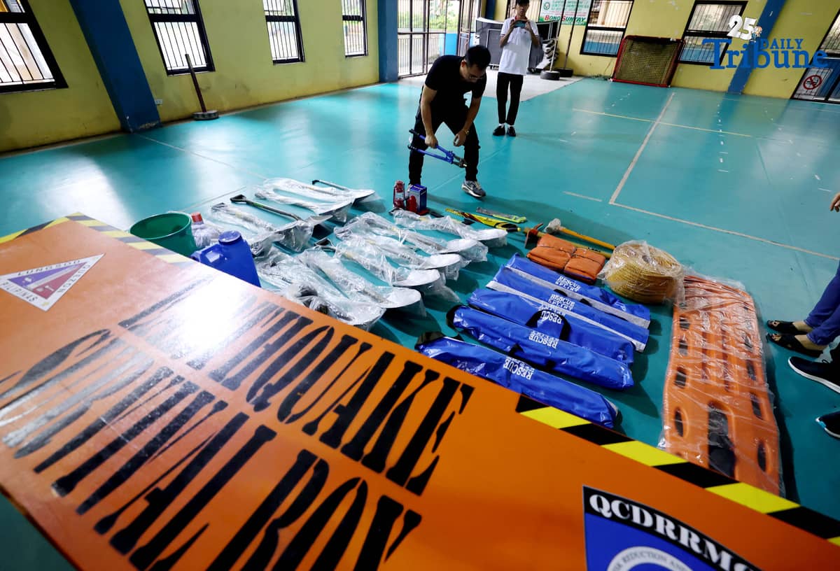 (October 14 2025) Disaster Risk Reduction and Management Council Coordinator Freddie Cayabyab conduct an inspection of “Earthquake Survival Box” issued to the Quezon City High School by the QC-DRRMO including the necessary tools essential for rescue operations during earthquakes or fire on on Tuesday, October 14, 2025. Photo/Analy Labor