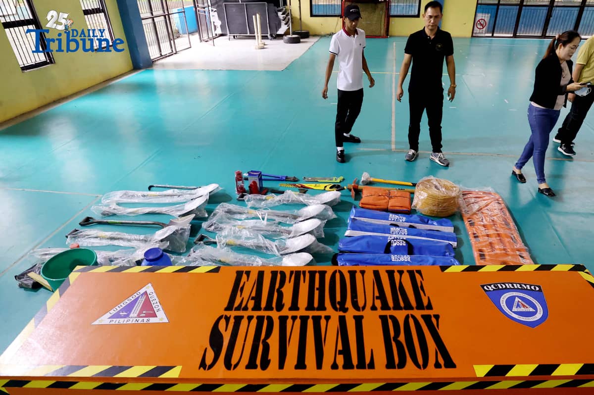 (October 14 2025) Disaster Risk Reduction and Management Council Coordinator Freddie Cayabyab conduct an inspection of “Earthquake Survival Box” issued to the Quezon City High School by the QC-DRRMO including the necessary tools essential for rescue operations during earthquakes or fire on on Tuesday, October 14, 2025. Photo/Analy Labor