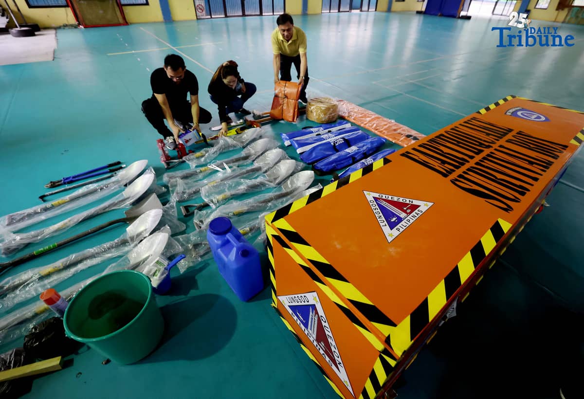 (October 14 2025) Disaster Risk Reduction and Management Council Coordinator Freddie Cayabyab conduct an inspection of “Earthquake Survival Box” issued to the Quezon City High School by the QC-DRRMO including the necessary tools essential for rescue operations during earthquakes or fire on on Tuesday, October 14, 2025. Photo/Analy Labor