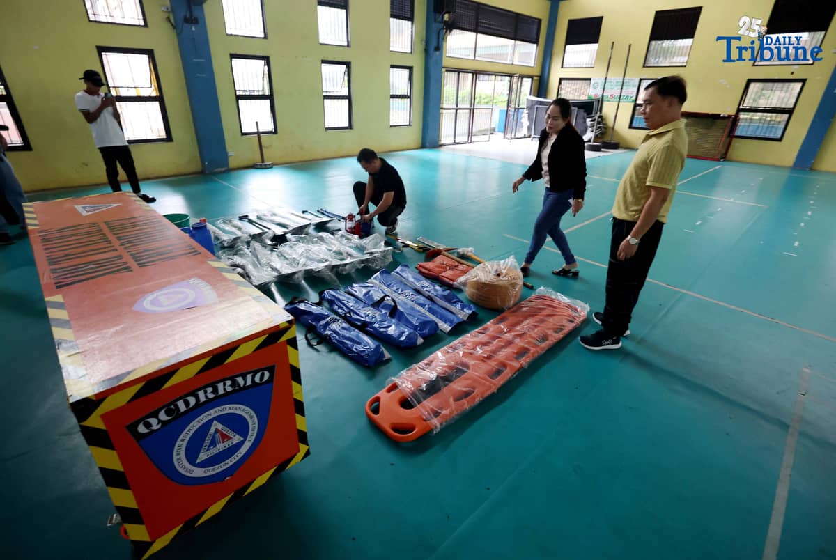 (October 14 2025) Disaster Risk Reduction and Management Council Coordinator Freddie Cayabyab conduct an inspection of “Earthquake Survival Box” issued to the Quezon City High School by the QC-DRRMO including the necessary tools essential for rescue operations during earthquakes or fire on on Tuesday, October 14, 2025. Photo/Analy Labor