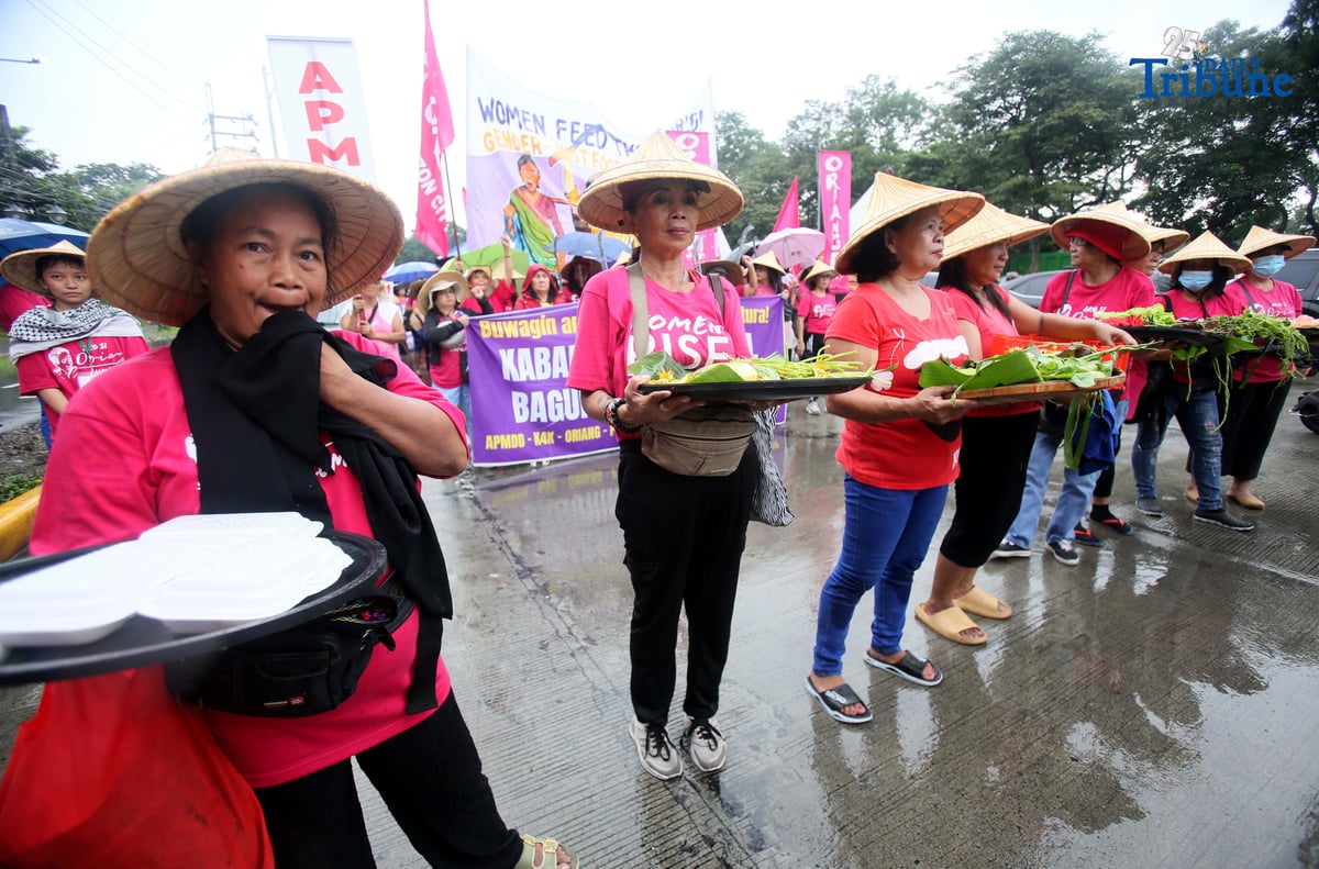 (October 15 2025) Militant group Oriang, K4K, Asian Peoples’ Movement on Debt and Development (APMDD), Philippine Movement for Climate Justice (PMCJ), Aniban ng Manggagawa sa Agrikultura (AMA, carrying vegetables as symbolize of their protest and march to the Department of Agriculture in Quezon City, to demand food for people, and accountability in the massive corruption palauging the national government and landlessness among poor peasants as they mark International Rural Women's Day on Wednesday. Photo/Analy Labor