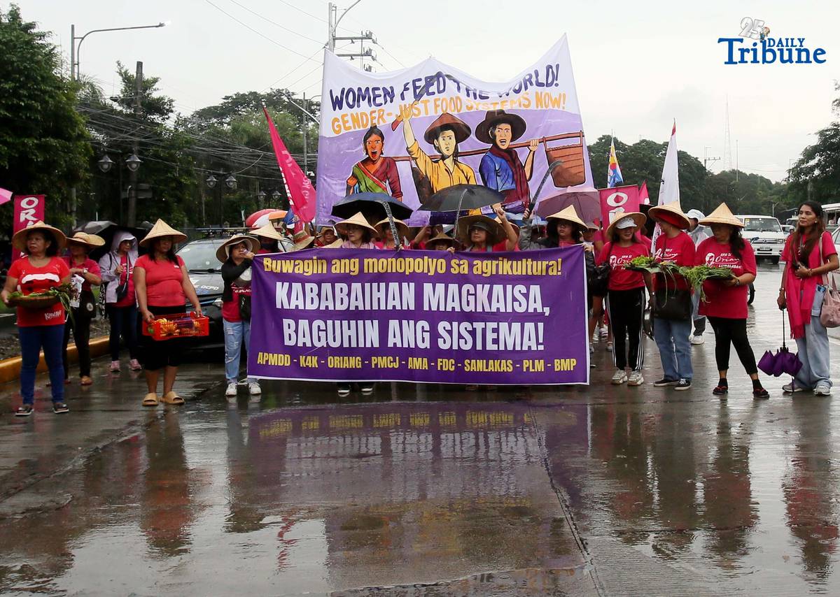 (October 15 2025) Militant group Oriang, K4K, Asian Peoples’ Movement on Debt and Development (APMDD), Philippine Movement for Climate Justice (PMCJ), Aniban ng Manggagawa sa Agrikultura (AMA, carrying vegetables as symbolize of their protest and march to the Department of Agriculture in Quezon City, to demand food for people, and accountability in the massive corruption palauging the national government and landlessness among poor peasants as they mark International Rural Women's Day on Wednesday. Photo/Analy Labor
