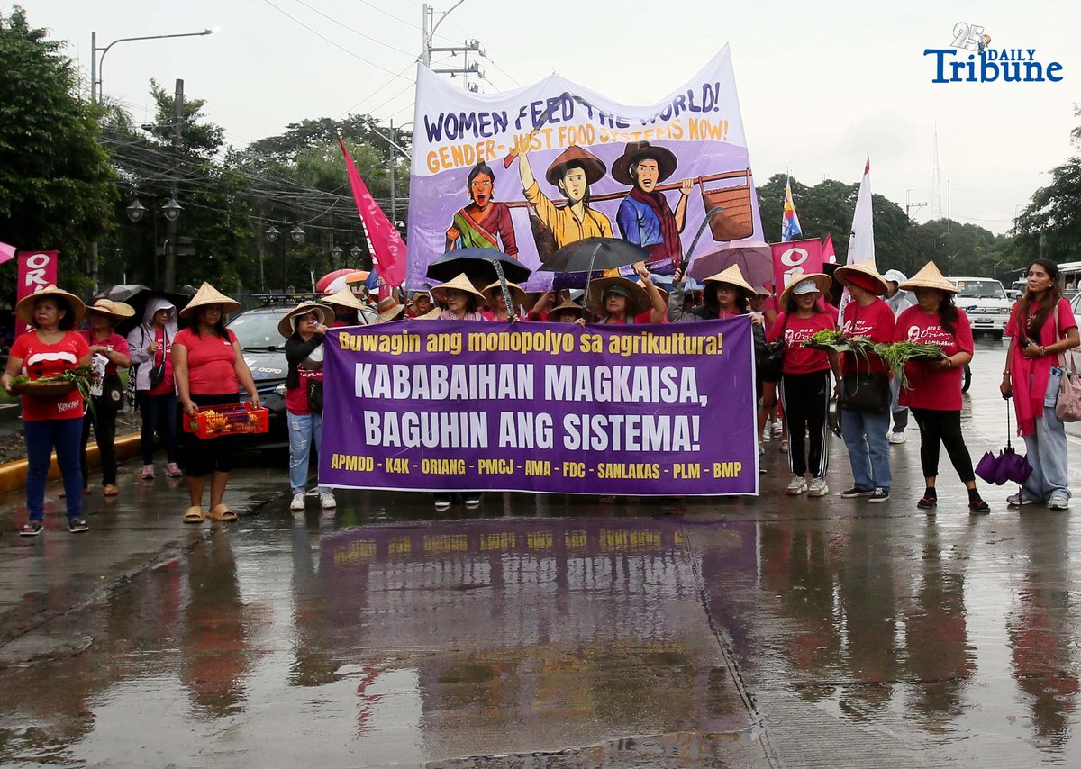 (October 15 2025) Militant group Oriang, K4K, Asian Peoples’ Movement on Debt and Development (APMDD), Philippine Movement for Climate Justice (PMCJ), Aniban ng Manggagawa sa Agrikultura (AMA, carrying vegetables as symbolize of their protest and march to the Department of Agriculture in Quezon City, to demand food for people, and accountability in the massive corruption palauging the national government and landlessness among poor peasants as they mark International Rural Women's Day on Wednesday. Photo/Analy Labor