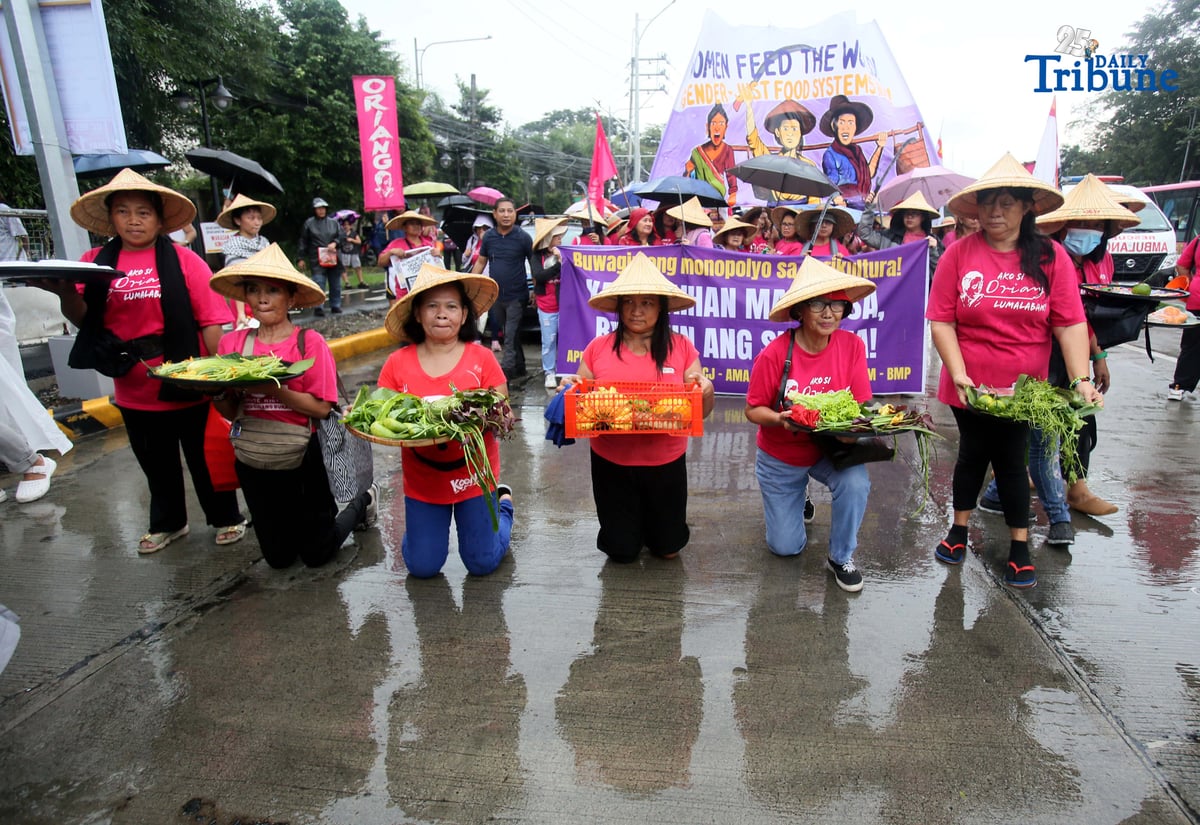(October 15 2025) Militant group Oriang, K4K, Asian Peoples’ Movement on Debt and Development (APMDD), Philippine Movement for Climate Justice (PMCJ), Aniban ng Manggagawa sa Agrikultura (AMA, carrying vegetables as symbolize of their protest and march to the Department of Agriculture in Quezon City, to demand food for people, and accountability in the massive corruption palauging the national government and landlessness among poor peasants as they mark International Rural Women's Day on Wednesday. Photo/Analy Labor