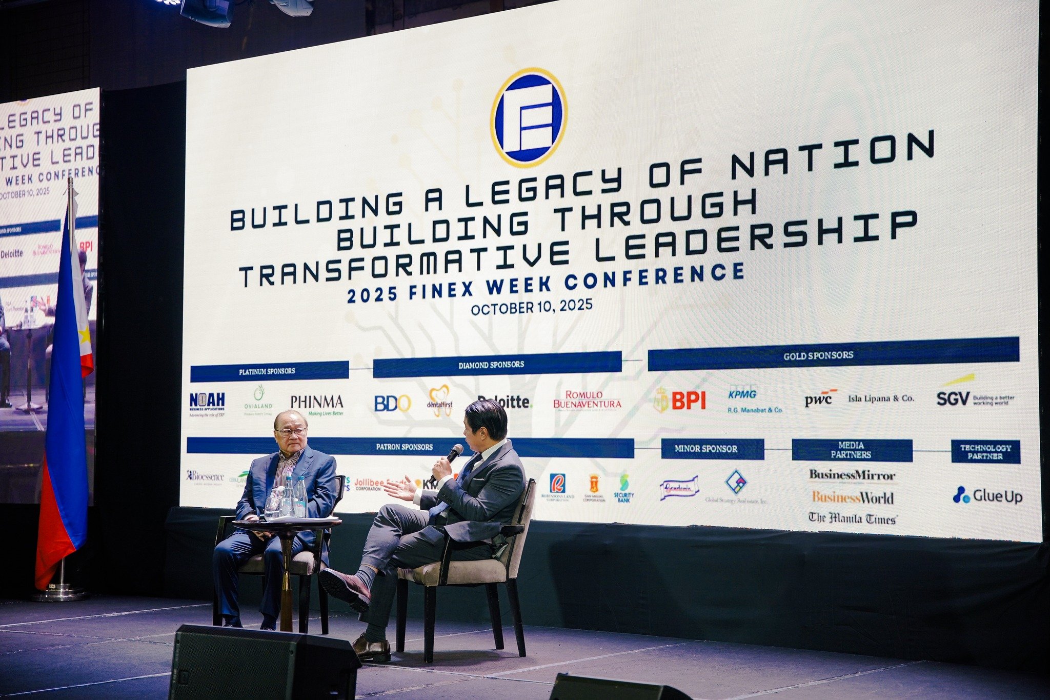 Metro Pacific Investments Corporation chairman, president and CEO Manuel V. Pangilinan (left) onstage after the delivery of his keynote address at the 57th Annual Conference of the Financial Executives Institute of the Philippines where he called on the country’s financial and corporate executives to take an active role in fighting corruption — warning that the cost of inaction creates deep damage in both society and the economy.