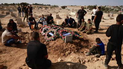 Hamas says committed to truce, returning hostage remains