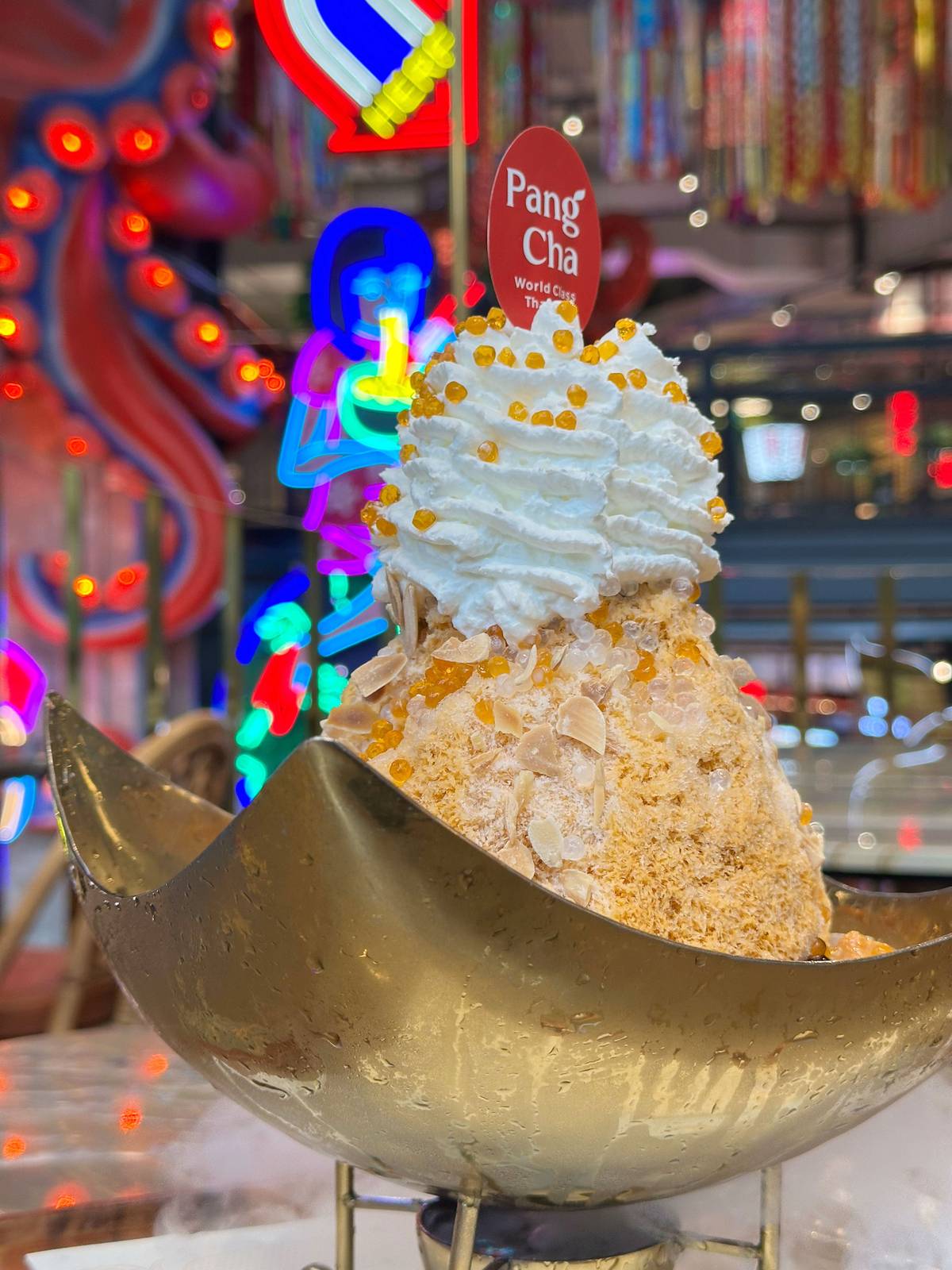 A
re-imagination of Thai Milk Tea. Pang Cha serves the iconic drink as a show-stopping shaved ice concoction.