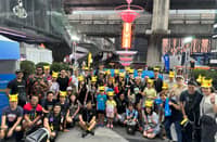 Pokemon Go Trainers from around the world gather for a commemorative photo.