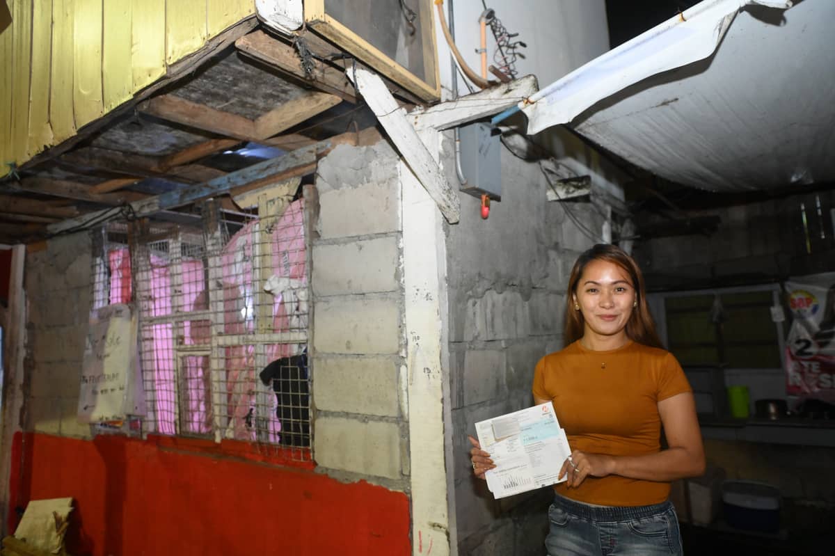 Empowering small businesses. Maan Cruz-Atienza is one of the many residents helped by OMF and Meralco through the Household Electrification Program, which assists low-income households within the franchise area so they can have their own safe and reliable access to electricity.