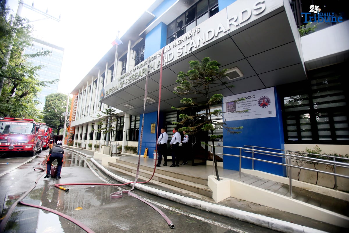 Firefighters rushed to contain a third-alarm fire that broke out at the Department of Public Works and Highways (DPWH) building along EDSA, Barangay Pinyahan, Quezon City, on Wednesday afternoon.