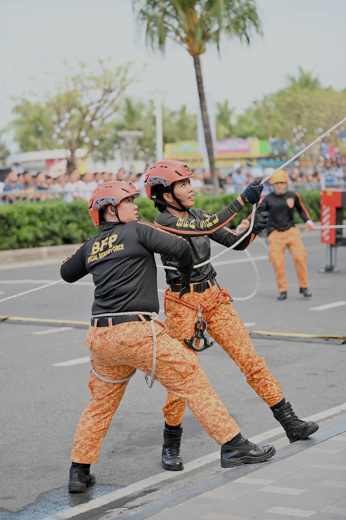 Female firefighters lead the 4th SM & BFP Nationwide Simultaneous Fire Drill, demonstrating their strength and resilience in fire prevention and disaster response.