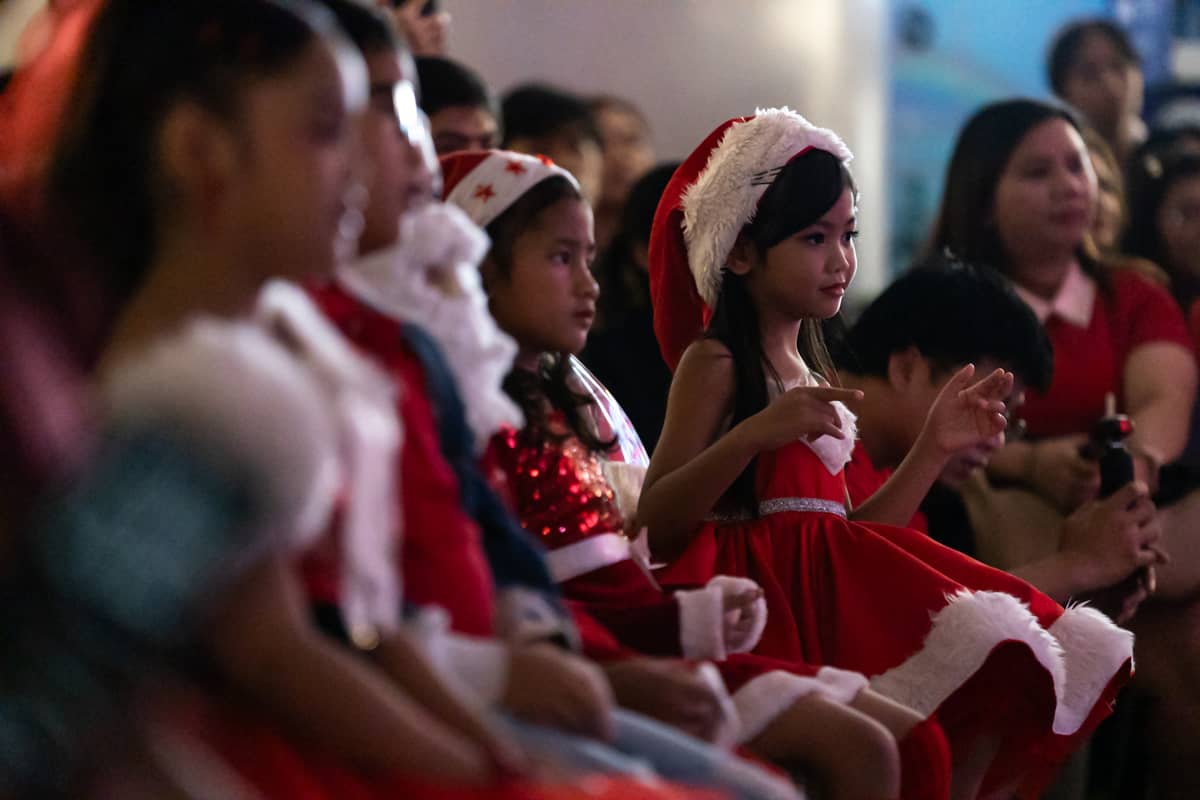 Children enjoy the Christmas tree lighting ceremony at SM City Manila on Friday, 24 October 2025, as the mall unveils its giant Christmas tree adorned with a large ribbon to usher in the holiday season and spread festive cheer.