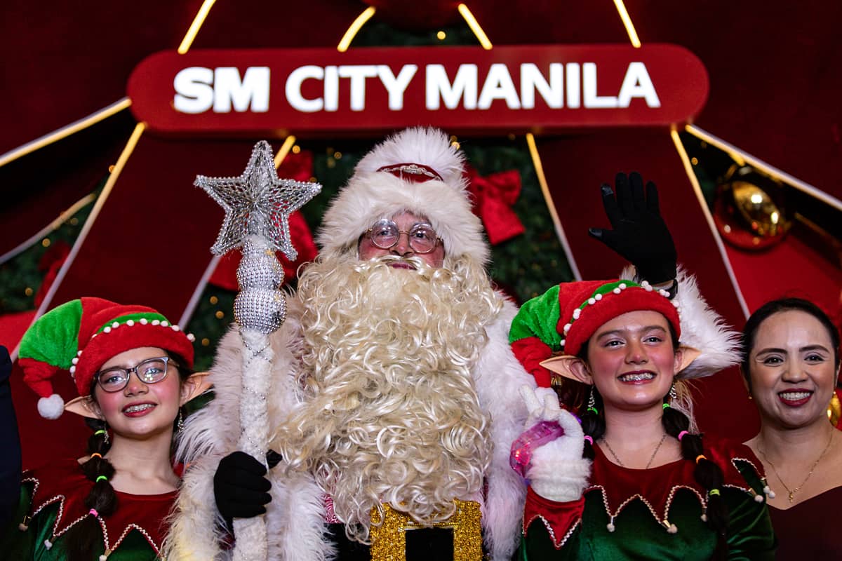 Children enjoy the Christmas tree lighting ceremony at SM City Manila on Friday, 24 October 2025, as the mall unveils its giant Christmas tree adorned with a large ribbon to usher in the holiday season and spread festive cheer.