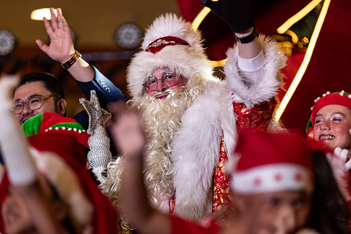 Children enjoy the Christmas tree lighting ceremony at SM City Manila on Friday, 24 October 2025, as the mall unveils its giant Christmas tree adorned with a large ribbon to usher in the holiday season and spread festive cheer.