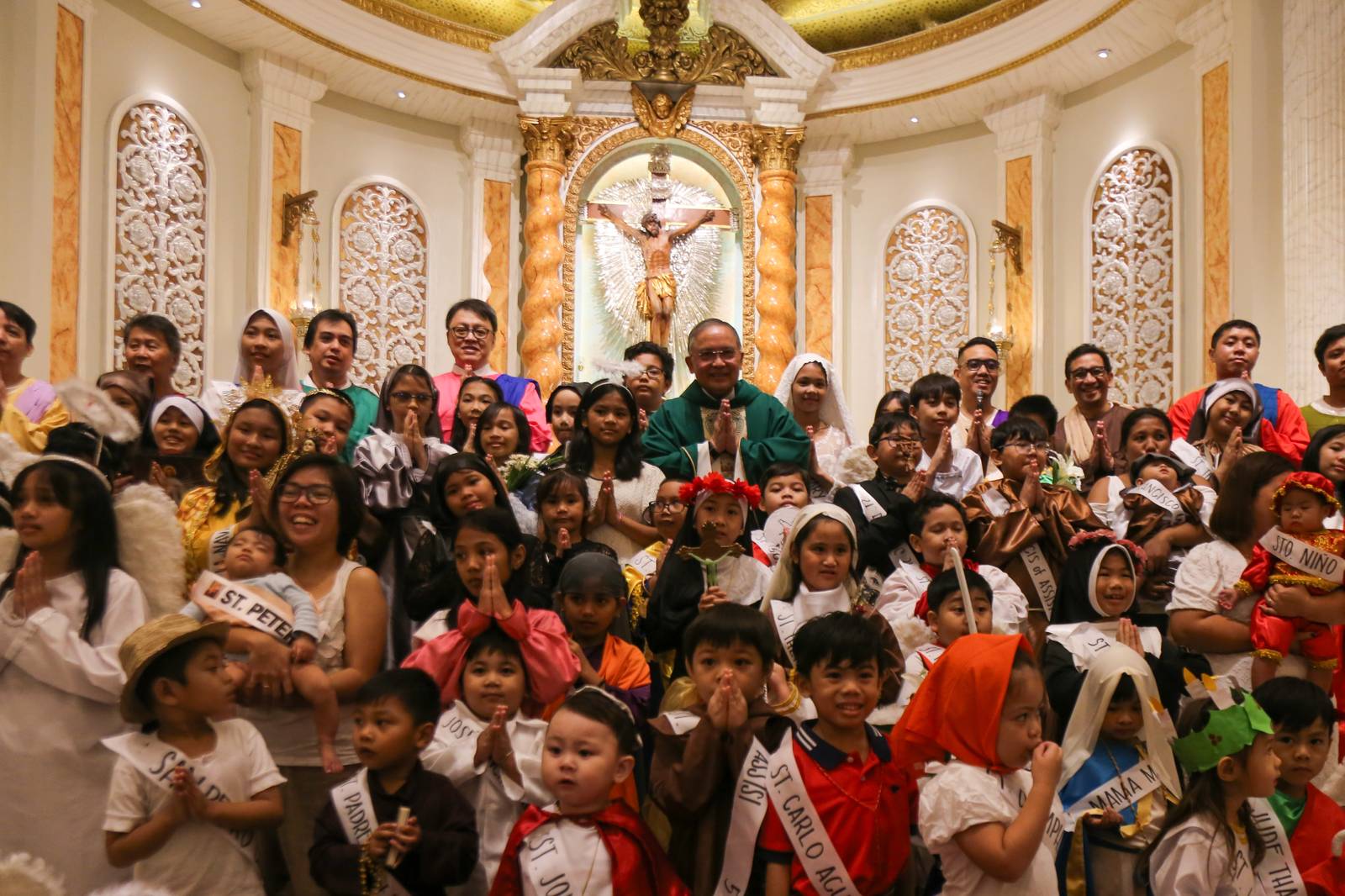 Children flock to Sta. Rita de Cascia Parish at PhilAm Homes in Quezon City on the morning of 26 October 2025 for their annual Parade of Saints. The parade aims to encourage the young to emulate the lives of the Catholic saints.