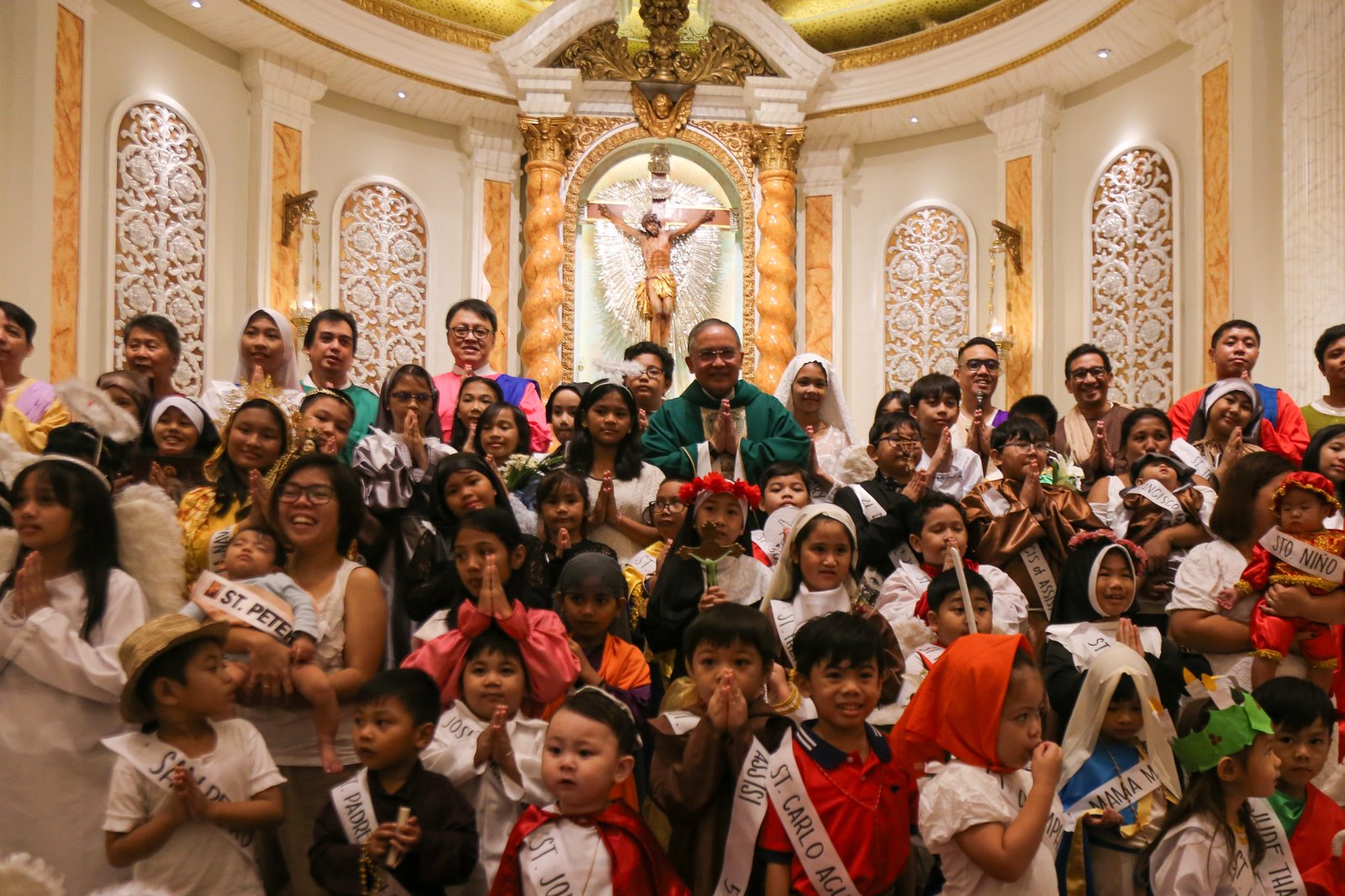 Children flock to Sta. Rita de Cascia Parish at PhilAm Homes in Quezon City on the morning of 26 October 2025 for their annual Parade of Saints. The parade aims to encourage the young to emulate the lives of the Catholic saints.