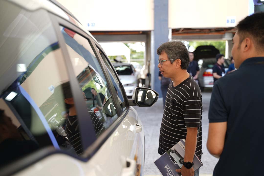 GUESTS explore the Chevrolet Captiva on display during the Clark International Festival of Speed.