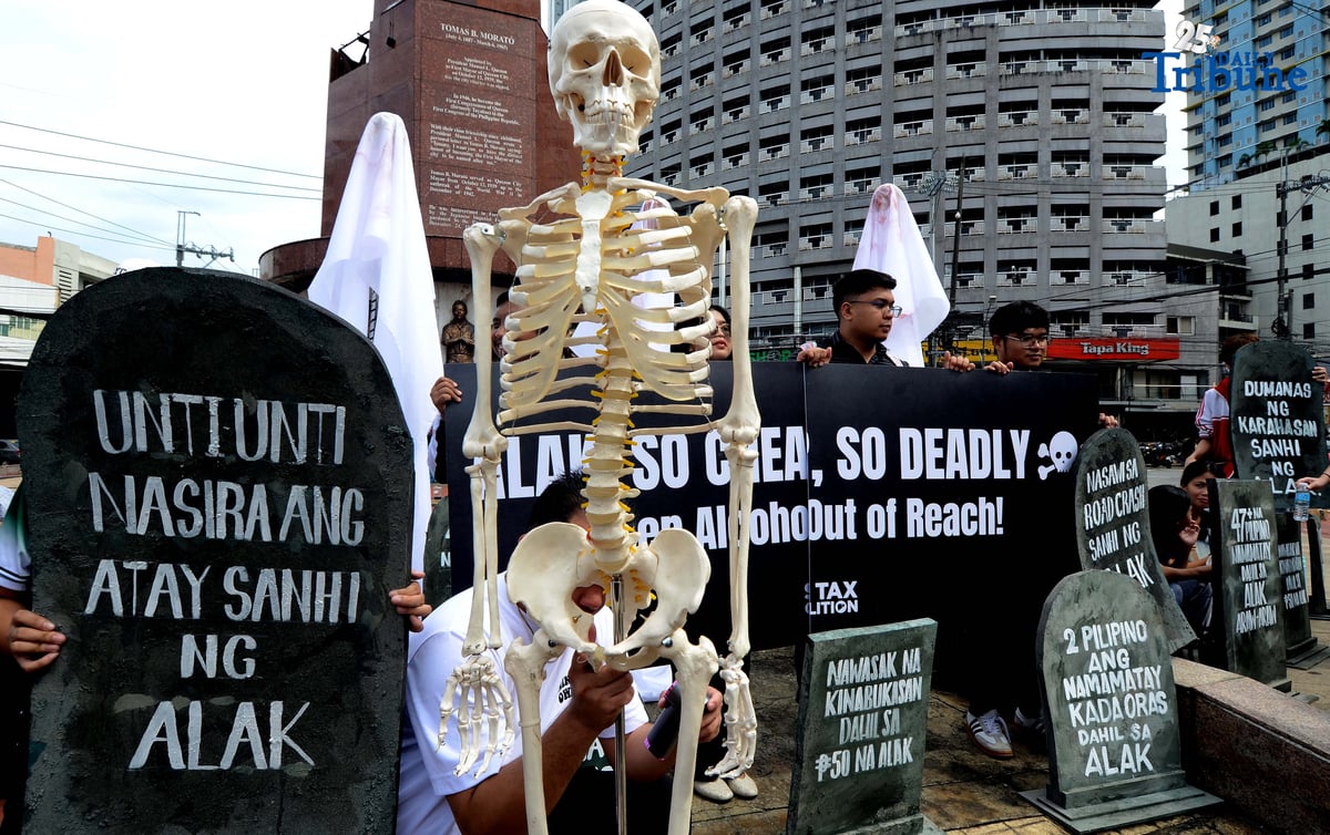 (October 28 2025) Youth leaders and members of the Sin Tax Coalition hold a halloween themed action at Brgy. South Triangle, Quezon City on Tuesday October 28 2025, to urge for higher alcohol taxes amid rising deaths and illnesses among young people of alcohol related. The symbolic action titled “So Cheap, So Deadly” feature tombstones representing lives lost to alcohol and ghost figures representing the alcohol industry. The campaign seeks to urge lawmakers to pass stronger alcohol control measures, including higher alcohol taxes, to protect young people. Photo/Analy Labor