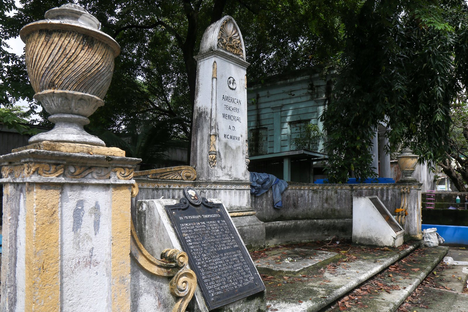 Dried leaves, single use plastics and discarded tarp sheet can be seen at the American Teachers Memorial inside Manila North Cemetery on this photo taken on 28 October 2025. Known also as the The American Little Teachers Plot, the memorial is dedicated to the American teachers who travelled to the Philippines in USS Thomas.
