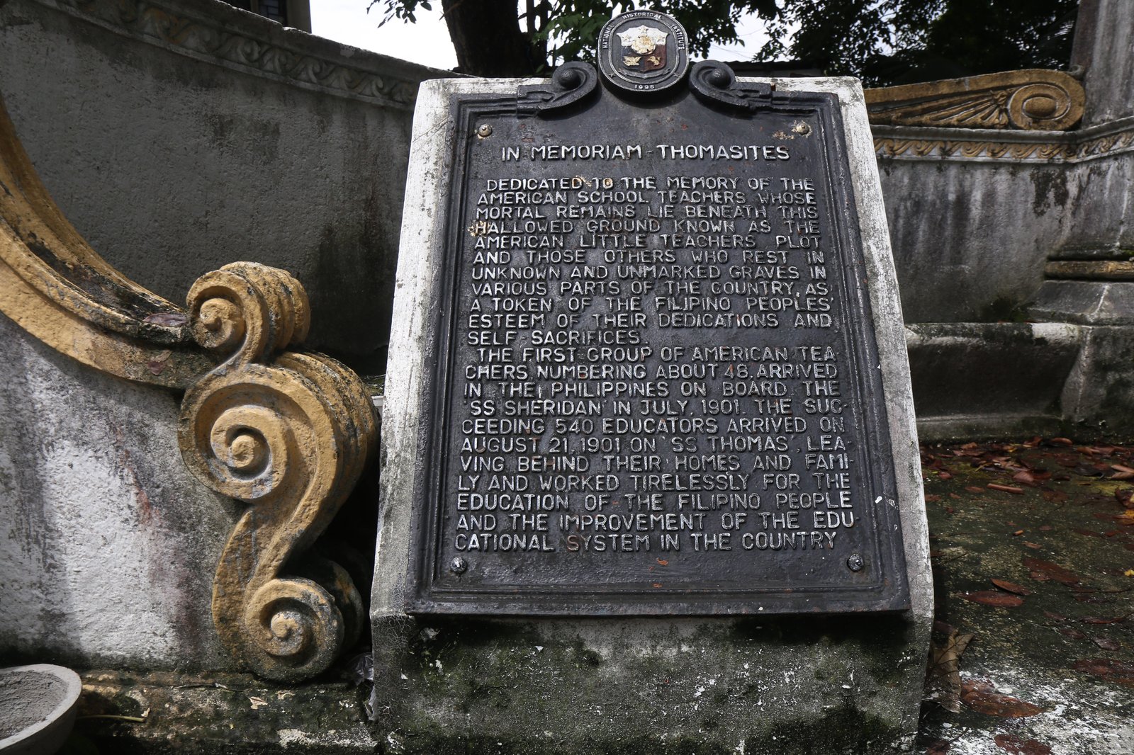 Dried leaves, single use plastics and discarded tarp sheet can be seen at the American Teachers Memorial inside Manila North Cemetery on this photo taken on 28 October 2025. Known also as the The American Little Teachers Plot, the memorial is dedicated to the American teachers who travelled to the Philippines in USS Thomas.
