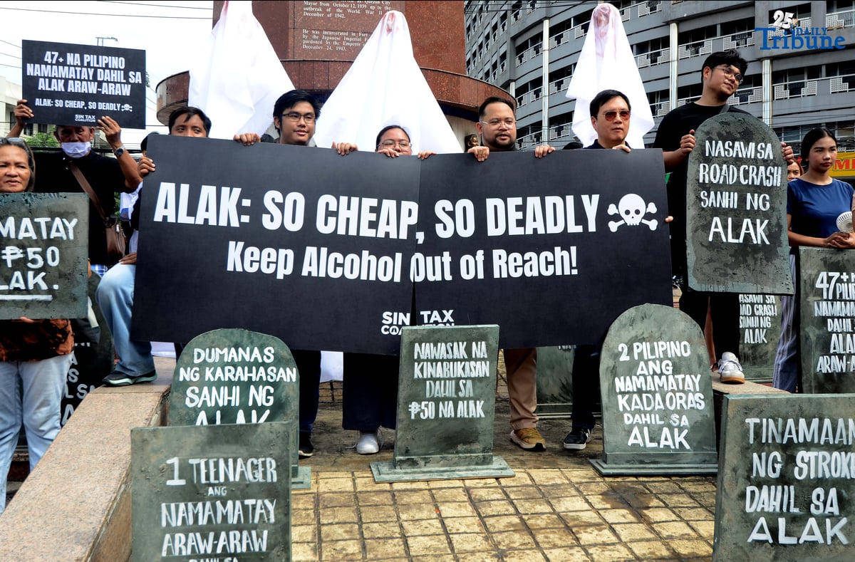 (October 28 2025) Youth leaders and members of the Sin Tax Coalition hold a halloween themed action at Brgy. South Triangle, Quezon City on Tuesday October 28 2025, to urge for higher alcohol taxes amid rising deaths and illnesses among young people of alcohol related. The symbolic action titled “So Cheap, So Deadly” feature tombstones representing lives lost to alcohol and ghost figures representing the alcohol industry. The campaign seeks to urge lawmakers to pass stronger alcohol control measures, including higher alcohol taxes, to protect young people. Photo/Analy Labor