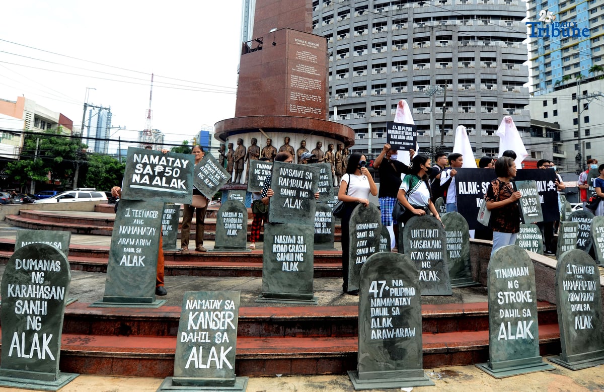 (October 28 2025) Youth leaders and members of the Sin Tax Coalition hold a halloween themed action at Brgy. South Triangle, Quezon City on Tuesday October 28 2025, to urge for higher alcohol taxes amid rising deaths and illnesses among young people of alcohol related. The symbolic action titled “So Cheap, So Deadly” feature tombstones representing lives lost to alcohol and ghost figures representing the alcohol industry. The campaign seeks to urge lawmakers to pass stronger alcohol control measures, including higher alcohol taxes, to protect young people. Photo/Analy Labor
