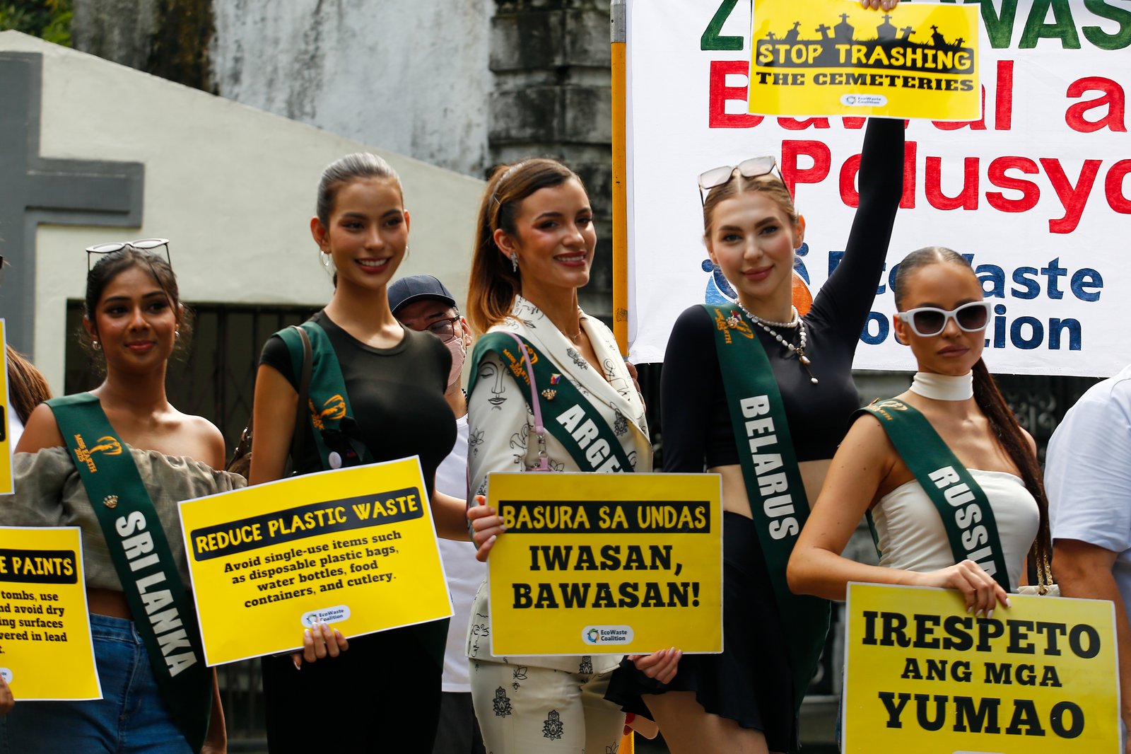 Miss Earth representatives gather at the Manila North Cemetery in Manila on Wednesday, 29 October 2025. Together with Ecowaste Coalition, Metro Manila Development Authority (MMDA), Department of Public Services (DPS) Manila, and other environmental advocates, the group urges the public to reduce waste and plastic pollution in celebrating All Saints' Day.