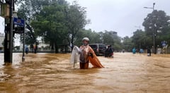 Record Vietnam rains kill seven, 
flood 100,000 homes