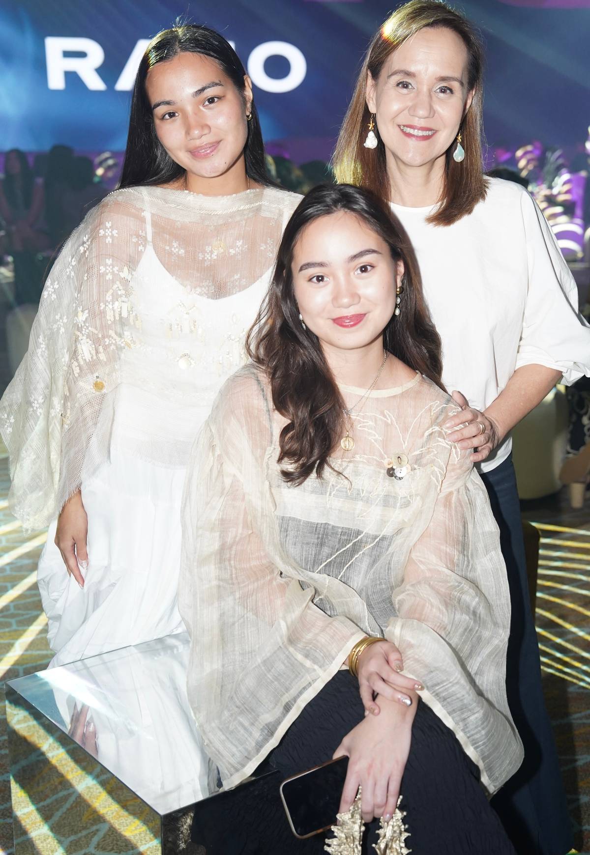 Bambi Mañosa-Tanjutco with her daughters Bella (standing) and Natasha (seated).