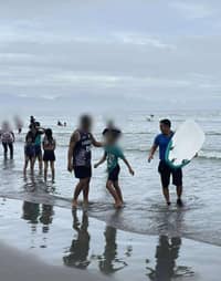 Using his surfboard, PMSG Jeffrey T. Delos Santos paddled his way towards a 10-year-old and saved him from near drowning due to strong currents pulling the victim away.