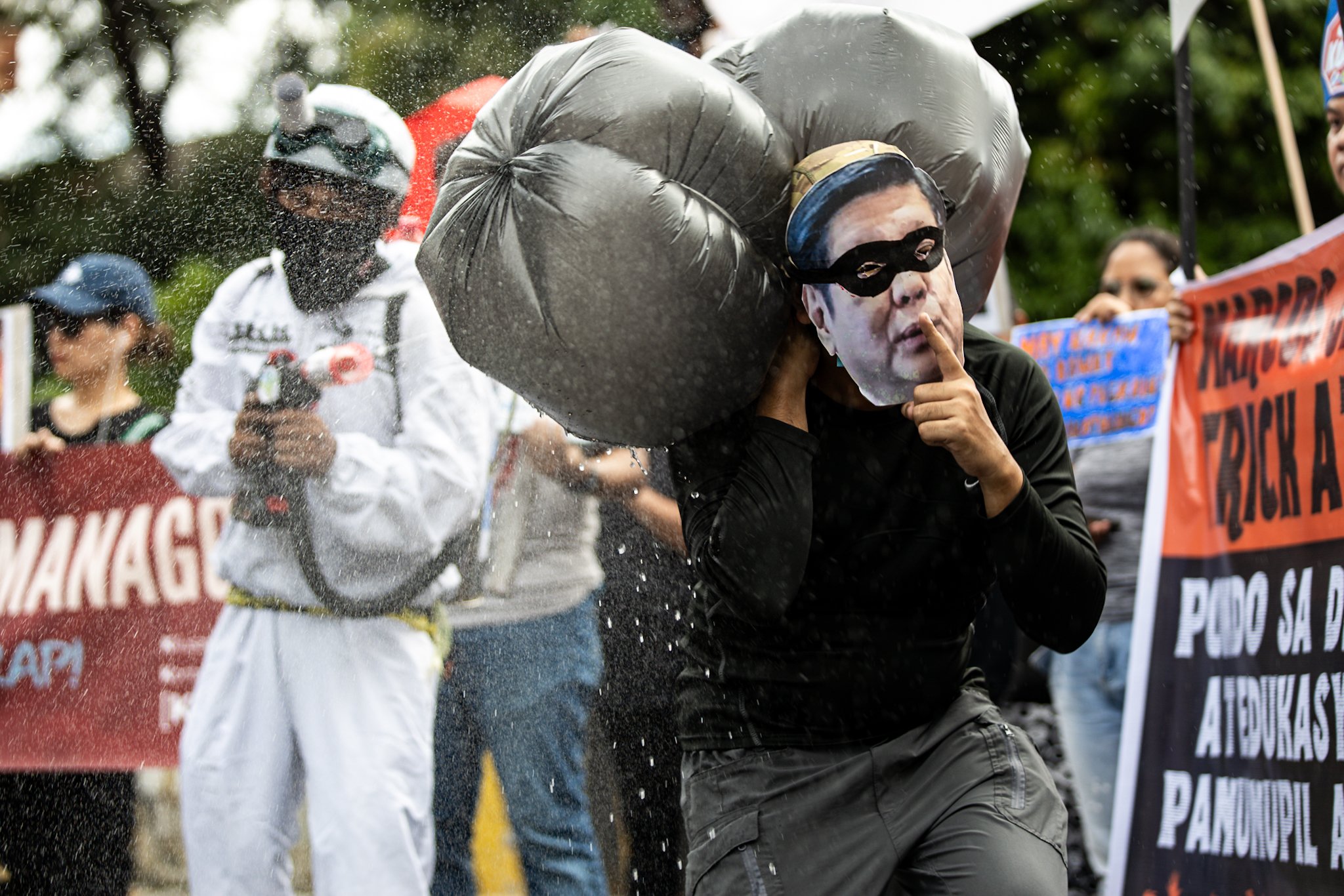 Scenes at the Halloween-themed anti-corruption rally