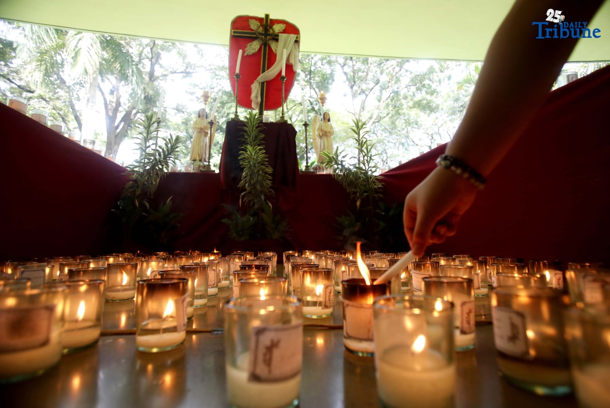 (November 01 2025) On All Saints Day Celebration Families offer prayers and light candles to their departed loved ones at the Parish of the Holy Sacrifice in University of the Philippines, Quezon City, on November 1 2025. Photo/Analy Labor