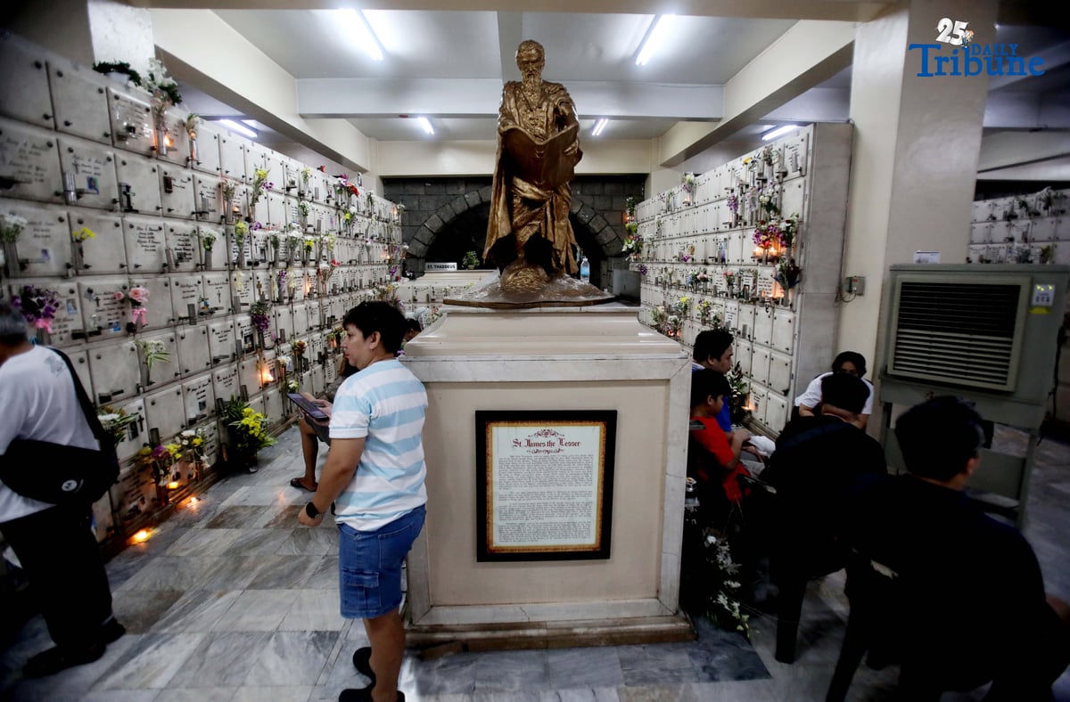 (November 01 2025) On All Saints Day Celebration Families offer flowers, prayers and light candles as they pay respect to their loved ones during the visit of their departed loved ones at St. Peter Parish and Shrine Columbarium on Saturday November 1 2025. Photo/Analy Labor