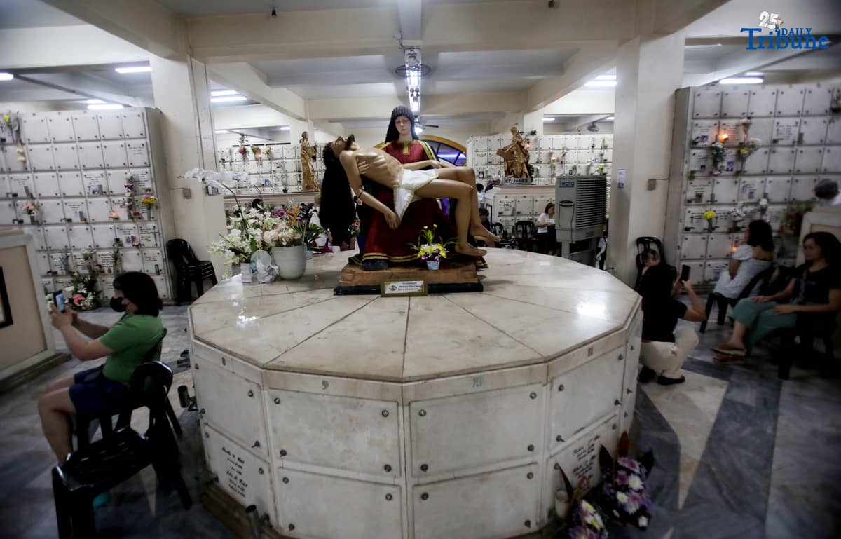 (November 01 2025) On All Saints Day Celebration Families offer flowers, prayers and light candles as they pay respect to their loved ones during the visit of their departed loved ones at St. Peter Parish and Shrine Columbarium on Saturday November 1 2025. Photo/Analy Labor