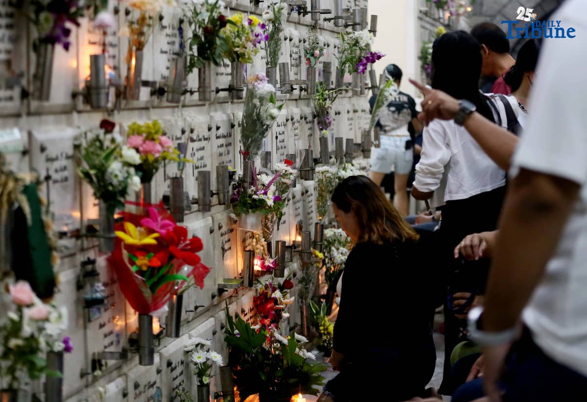 (November 01 2025) On All Saints Day Celebration Families offer flowers, prayers and light candles as they pay respect to their loved ones during the visit of their departed loved ones at St. Peter Parish and Shrine Columbarium on Saturday November 1 2025. Photo/Analy Labor