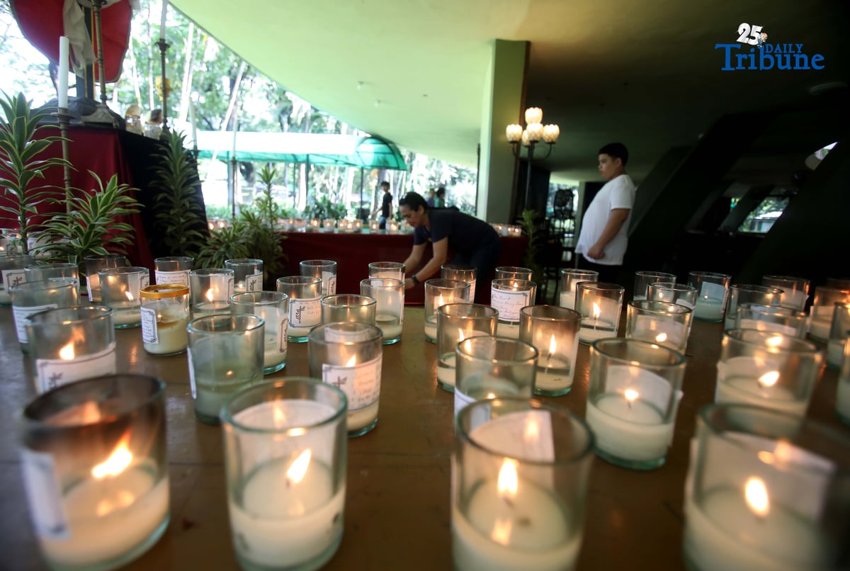 (November 01 2025) On All Saints Day Celebration Families offer prayers and light candles to their departed loved ones at the Parish of the Holy Sacrifice in University of the Philippines, Quezon City, on November 1 2025. Photo/Analy Labor