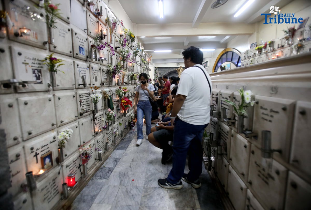 (November 01 2025) On All Saints Day Celebration Families offer flowers, prayers and light candles as they pay respect to their loved ones during the visit of their departed loved ones at St. Peter Parish and Shrine Columbarium on Saturday November 1 2025. Photo/Analy Labor