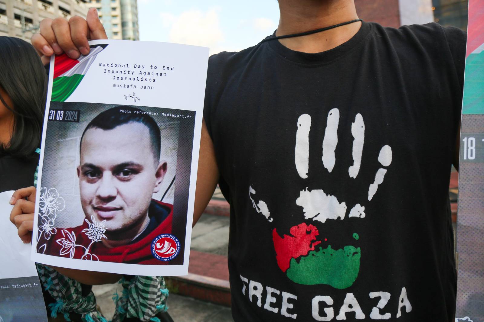 Journalists, students, human rights defenders, and press freedom advocates gather at the Boy Scouts Circle on Tomas Morato Avenue in Quezon City on the International Day to End Impunity for Crimes Against Journalists, 02 November 2025, as they commemorate the fallen journalists in Palestine and the Philippines who were killed while doing their duty.