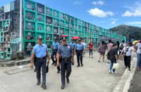 Officers from the Quezon City Police District inspect the Novaliches Public Cemetery in Novaliches Proper, Quezon City in observance of Oplan ‘Ligtas Undas’ on Sunday.