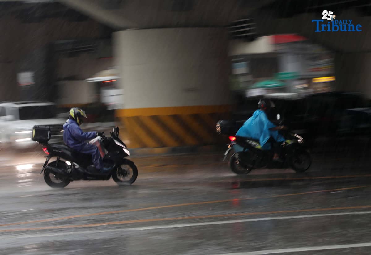 Commuters are braving the downpour with umbrellas and raincoats along EDSA in Quezon City. PAGASA says a shear line is affecting parts of Northern and Central Luzon.