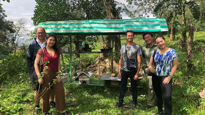 Teresa and her Co-Founder Dana Marquez with their partner beekeepers, wild honey gatherers, and biodiversity officers in Negros.