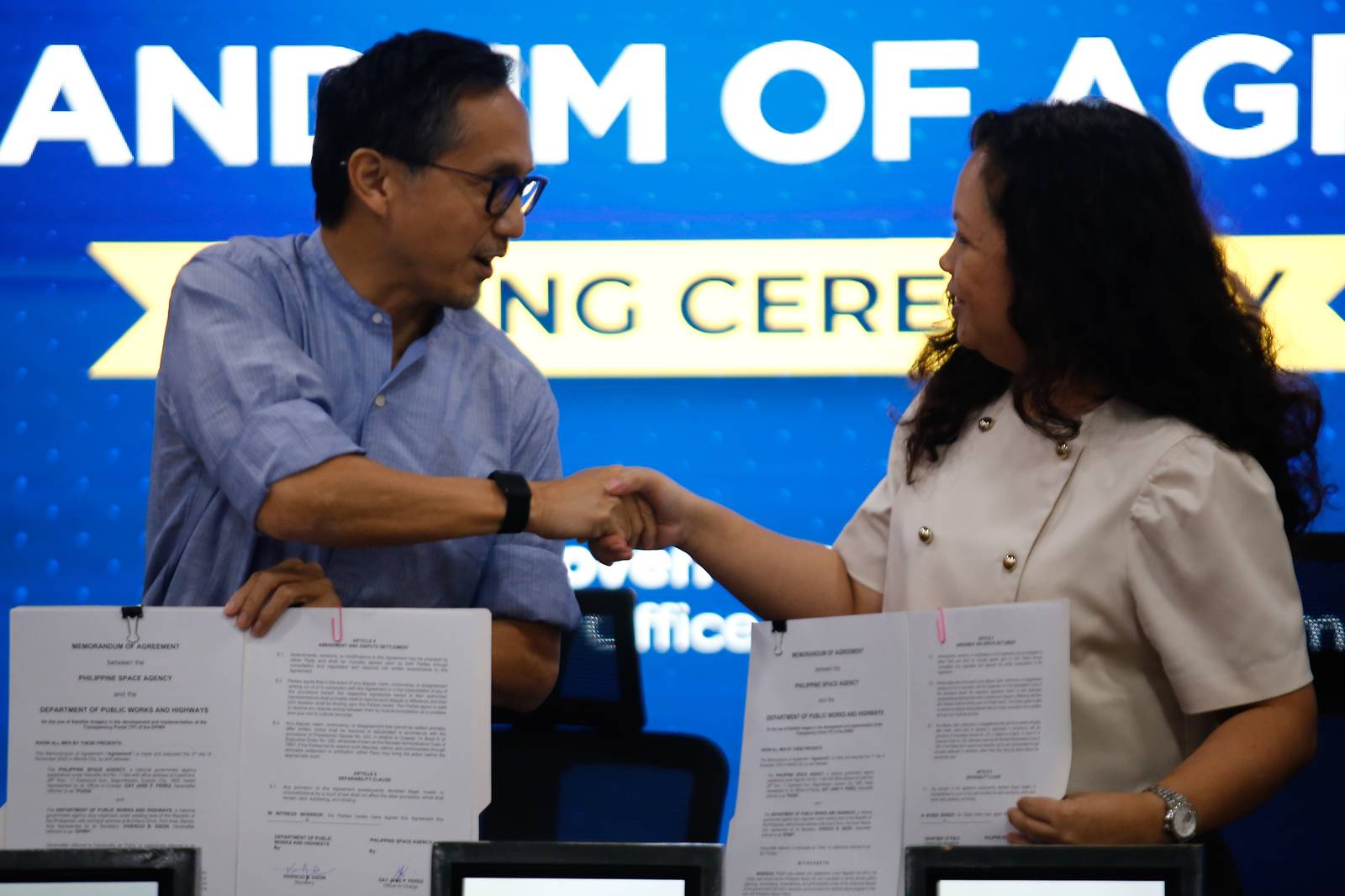 Department of Public Works and Highways Secretary Vince Dizon signs a memorandum of agreement with the Philippine Space Agency, represented by Officer-in-Charge Dr. Gay Jane Perez, at the DPWH Office in Manila on the morning of 03 November 2025. The agreement aims to harness space science and technology and utilize geospatial analytics, historical data, and images in project monitoring.