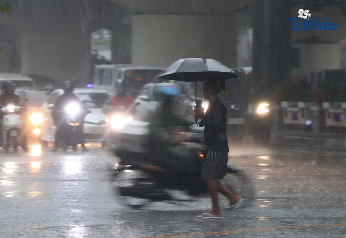 Commuters are braving the downpour with umbrellas and raincoats along EDSA in Quezon City. PAGASA says a shear line is affecting parts of Northern and Central Luzon.